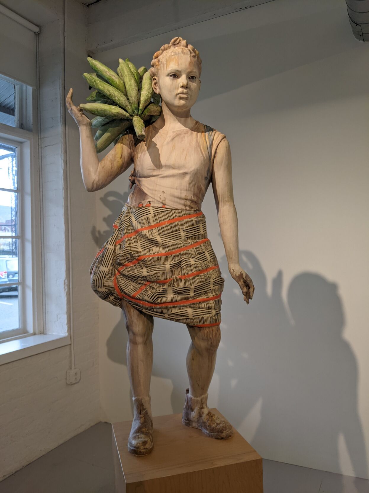 Statue of girl carrying bananas